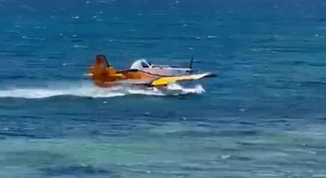 Denizden su alan uçağın olumsuz hava şartları nedeniyle kalkış yapamadığı anlar kamerada